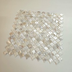 Texture of the backsplash in natural Mother of Pearl Silene Blanc, scale pattern, for an elegant bathroom tile finish.