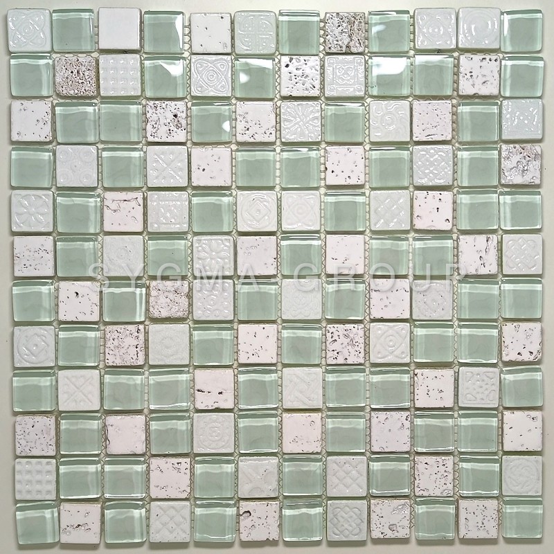 Installation detail of a white bathroom mosaic tile with embossed patterns on the stone pieces.