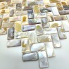 Sheet of natural shell shower wall tile in a herringbone pattern.